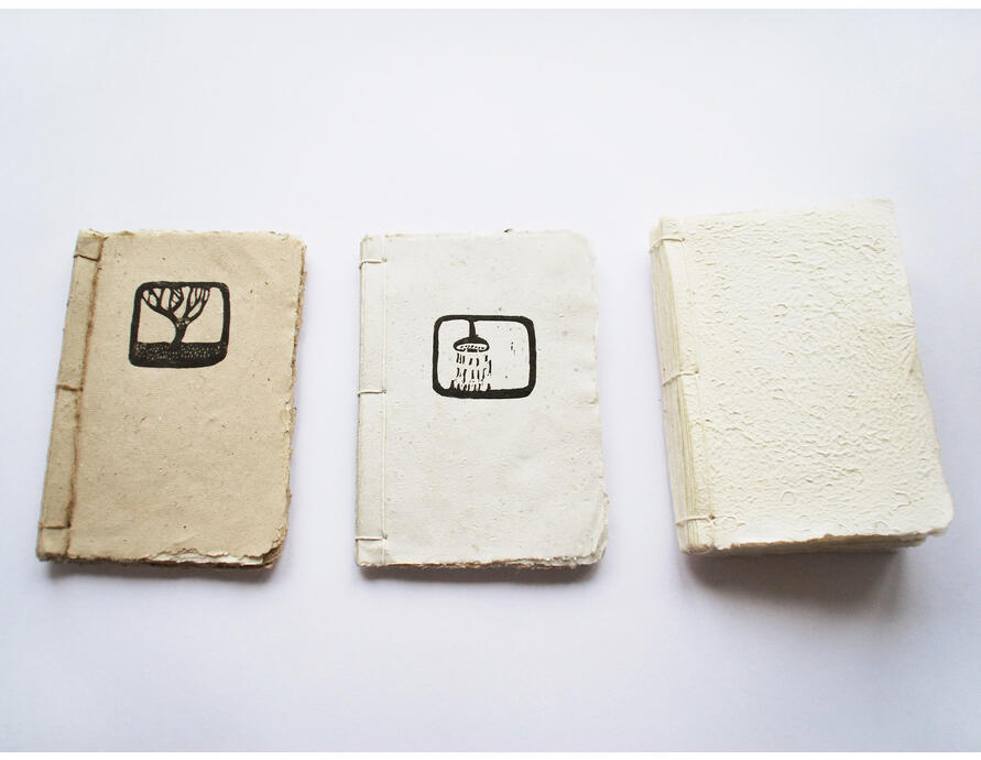 HANDMADE BOOKS- Collection of four handmade books of poetry. The papers are made from recycled old drawings, and the illustrations and texts are created using linocut. Three of the texts are written by me, and the fourth is from Haiku author Basho.”